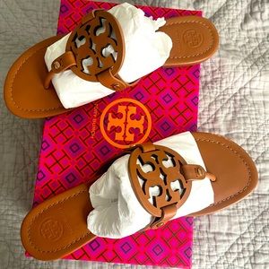 Tory Burch thong sandals.
